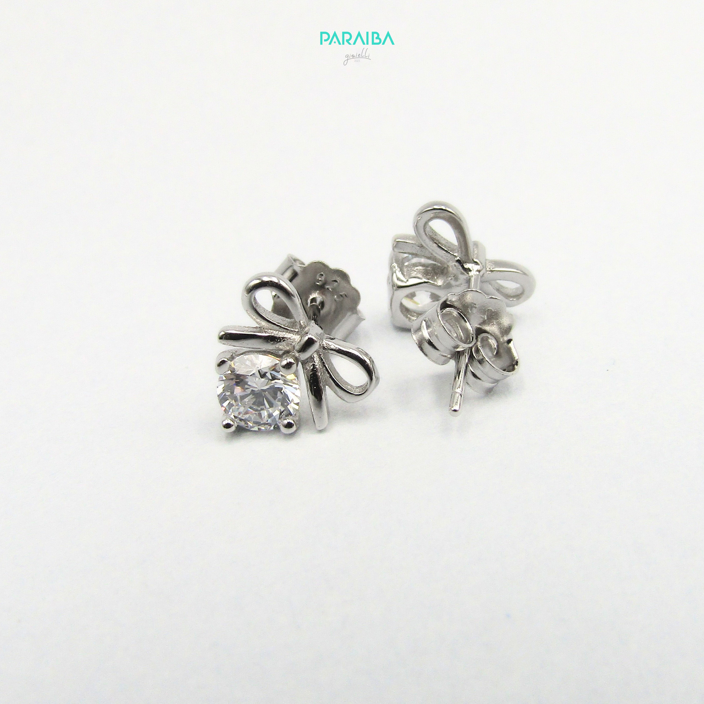 Bow and white stone earrings